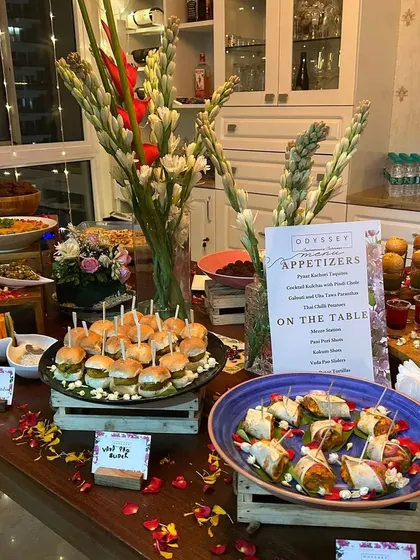 Another angle of our festive Diwali spread, showcasing the variety of appetizers and the beautiful floral arrangements that create a celebratory atmosphere.