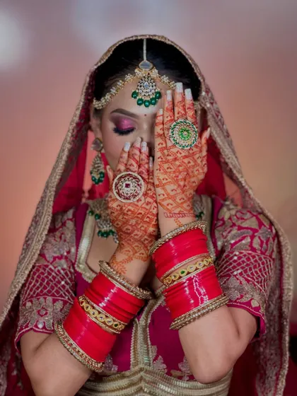 A close-up of the eye makeup and henna. The soft, shimmery eyeshadow and perfectly winged liner are key elements of this look.
