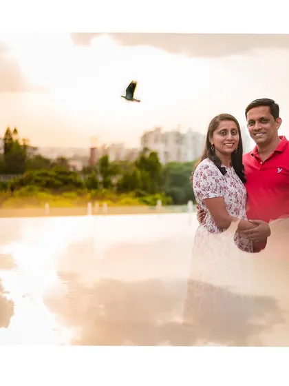 A beautiful double exposure style portrait of a couple against a sunset sky. We love getting creative to produce truly unique images for you.
