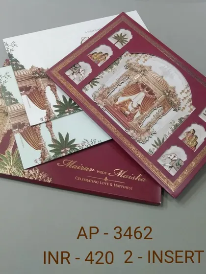 This invitation captures the heart of a traditional Indian wedding with a beautiful illustration of a bride in a doli. The rich maroon color and gold foil border make it a classic and timeless choice for your shaadi card.