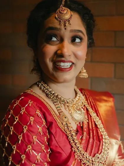 Her expressive eyes and bright smile say it all. The makeup is there to enhance, not overshadow, her natural beauty and happiness.