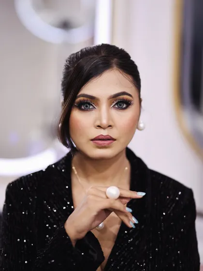 Beyond bridal, I create glamorous looks for any party or event. This look features a dramatic smokey eye with a flawless base, perfect for a cocktail party or reception. It’s all about making a statement and feeling confident.