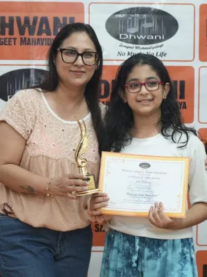 A student with her mother, celebrating her achievement.