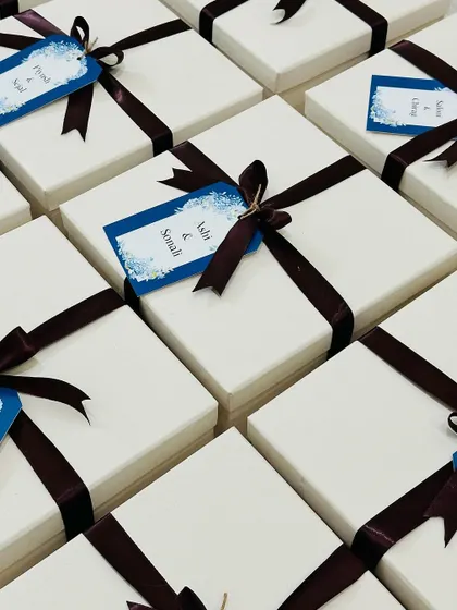 Simple, elegant, and personal. These white gift boxes are perfect for any member of the wedding party.