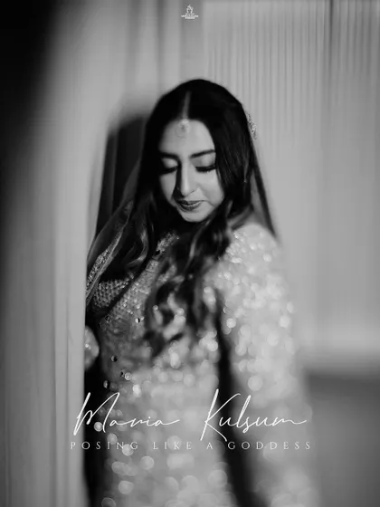 A duplicate of ID 86, this black and white portrait captures a Muslim bride's serene and graceful presence.
