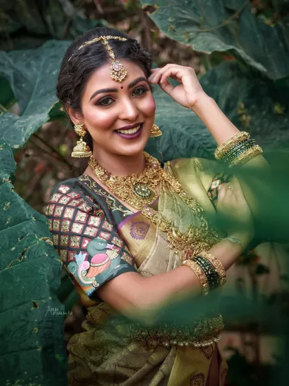 A stunning, professionally shot portrait for a bridal inspiration series. The makeup is bold and defined, perfect for a high-fashion editorial look.