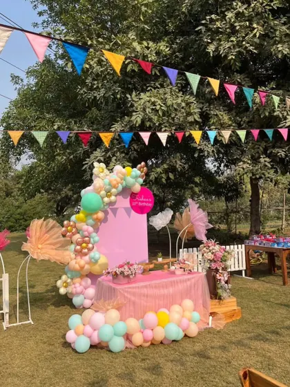 The colorful party decor set against the natural backdrop of our farm's trees and open sky.