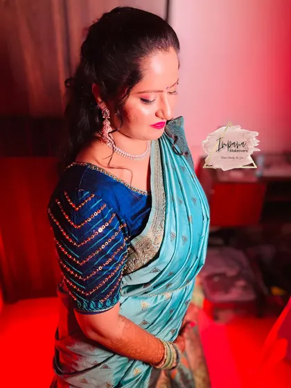A close-up of the bride's Mehendi look. The makeup is glamorous yet comfortable, designed to last through the long event.