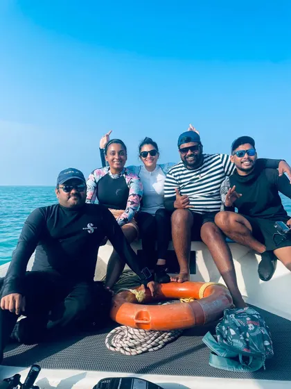 A group of friends enjoying the boat ride. The journey is just as beautiful as the destination.