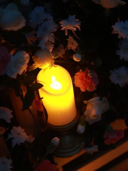 The soft glow of a single candle nestled among fresh flowers. It's these small, beautiful details that come together to create a truly romantic and memorable experience.