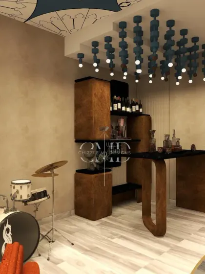 The bar area in the music lounge features a unique stepped wooden bar unit and a custom cluster of pendant lights, perfect for setting the mood.