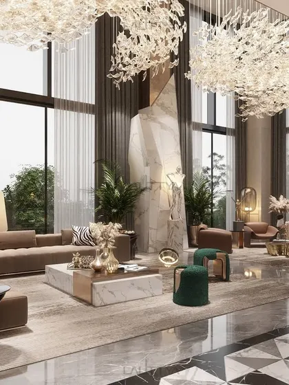 A closer look at the seating arrangement in the double-height living room. We used a mix of neutral sofas, green poufs, and a large-scale sculpture to ground the immense volume of the space, making it feel both grand and intimate.