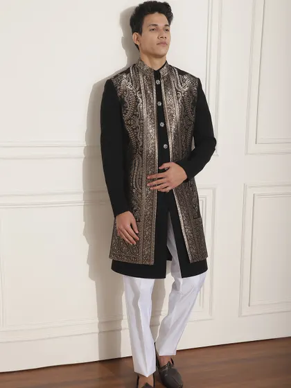 This black Indo-Western outfit with a stunning silver embroidered long jacket is a perfect choice for a Sangeet or reception. It's a glamorous look that is sure to turn heads.