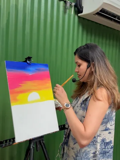 Demonstrating how to blend colors for a sunset sky. I break down every painting into simple, manageable steps so no one feels overwhelmed.