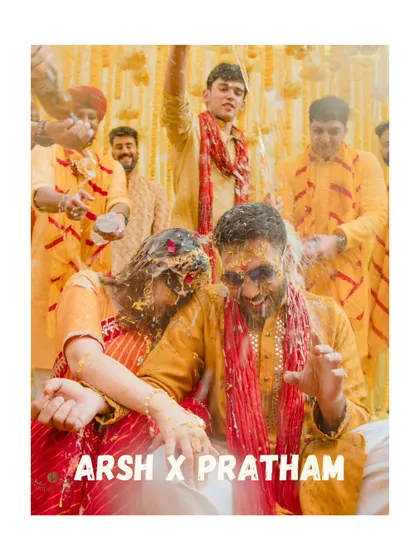 A fun, candid shot of the couple during their haldi, getting drenched in water and turmeric. This image perfectly captures the wild and joyous spirit of the celebration.
