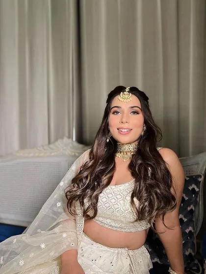 A subtle and glamorous day look for a wedding guest. The soft, romantic curls and glowing makeup create a beautiful and elegant style.