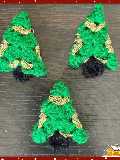 My Christmas tree brooches, complete with a dark trunk and golden garland details, are a classic choice for a festive accessory.