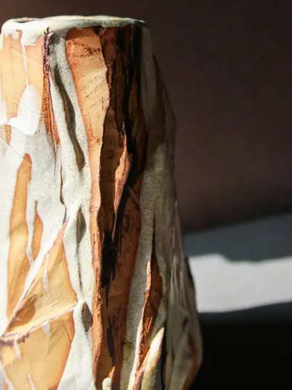 The sharp, faceted edges of this Kurinuki vase create a strong silhouette. The technique allows for so much expression, turning a simple vase into a piece of art.