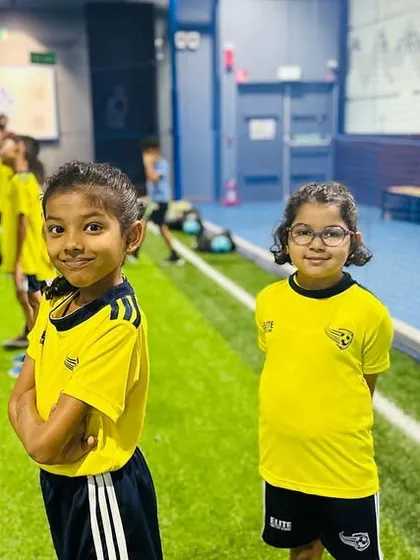 Two young players posing for the camera. The friendships made here are one of the best parts of being in our academy.