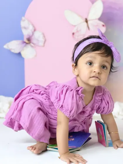 A magical unicorn and butterfly theme for a first birthday. The pastel colors, whimsical props, and dreamy backdrop create a true fairy tale setting.