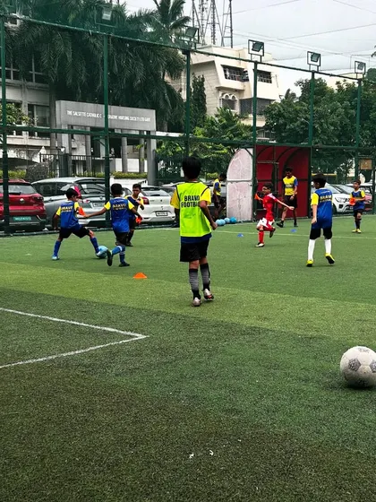 A practice match in full swing, where players apply the skills they have learned.