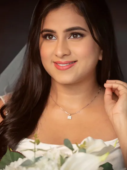 Simplicity at its best. A close-up portrait showcasing her flawless, natural-looking makeup and serene expression.