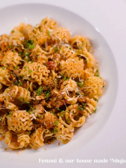 A close-up of our Festoni pasta with house-made 'Nduja. The unique shape of the pasta catches every bit of the spicy, flavourful sausage sauce, making every bite incredible.