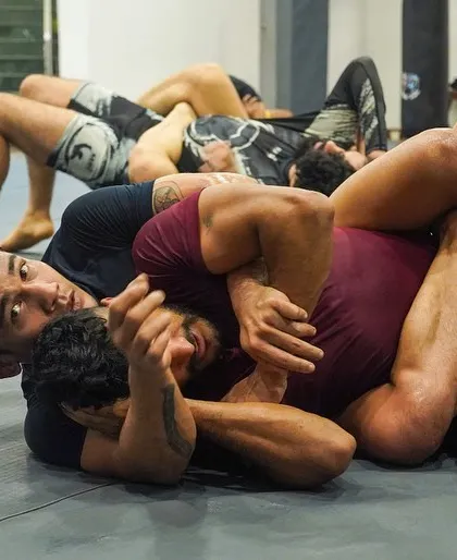 A complex grappling exchange on the mat. Our fighters are trained to navigate and dominate these intricate positions.