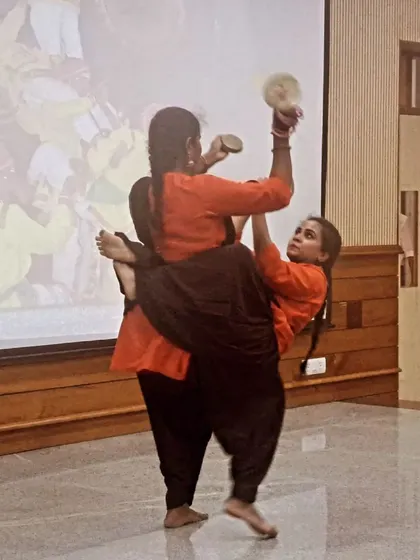 A demonstration of Kamsale, showcasing the acrobatic and rhythmic elements of this folk form.