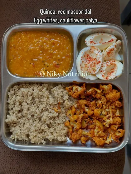 A gluten-free and eggetarian meal of quinoa, red masoor dal, boiled egg whites, and cauliflower palya.