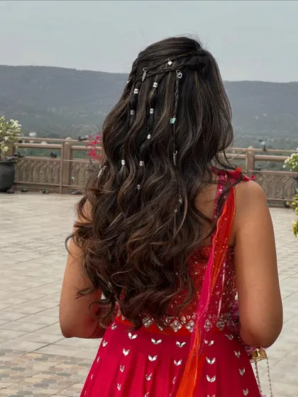 Another view of the carnival hairstyle, showing the delicate silver beads woven into the braids.