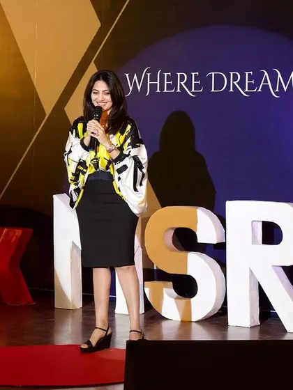 Standing on the iconic red circle at TEDx MSRIT, a stage "Where Dreams Ascend." It was a dream come true for me to share my message here.