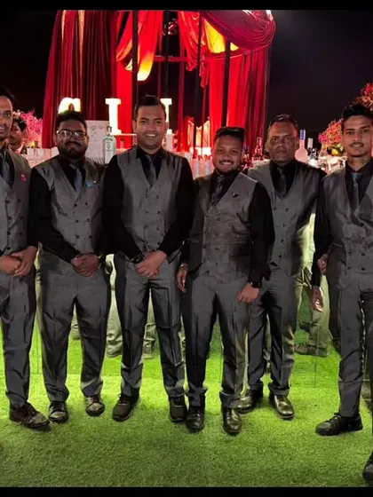 Our team in sharp grey vests, ready for a formal evening event. We adapt our look to suit the formality and style of every occasion.