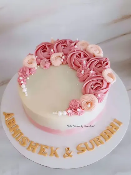 An anniversary cake that is simple, elegant, and made completely without fondant. The beauty is in the details, with delicate pink buttercream rosettes piped by hand.