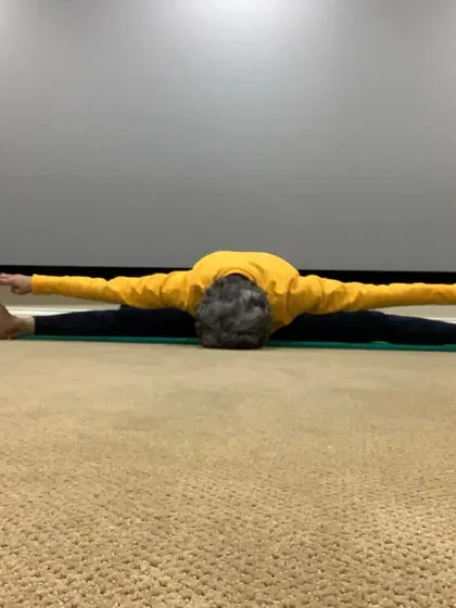 A deep forward bend in a wide-legged seated position. This asana is fantastic for releasing tension in the lower back and inner thighs.