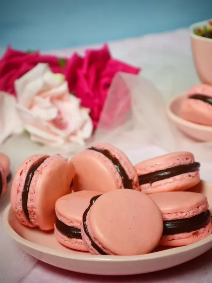 A closer look at my French macarons. They have the perfect texture with a crisp shell, a chewy interior, and a smooth, decadent filling. They are a perfect pairing with a cup of black coffee.