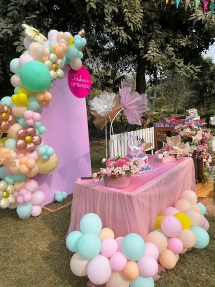 Another angle of the pastel birthday decor, showing how we transform our green space into a personalized party paradise.