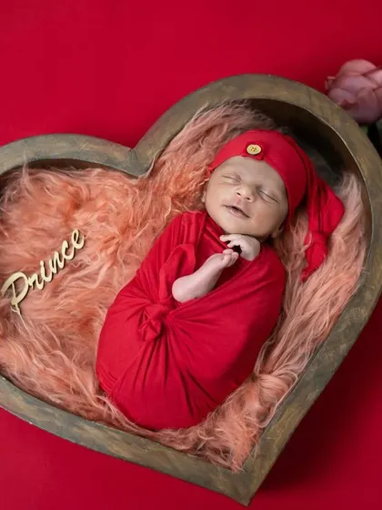 Another angle of our little prince, showing his peaceful smile. We always take our time to wait for these magical, fleeting expressions during our newborn photoshoots.