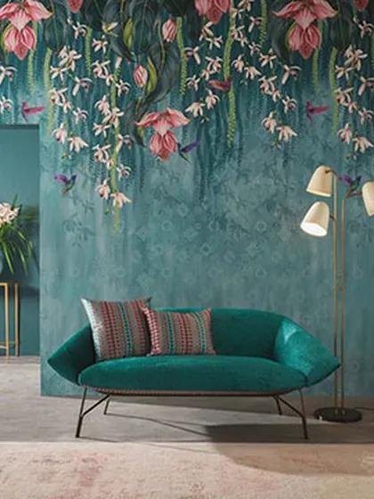 A beautiful floral wallpaper with hanging blossoms and hummingbirds. This design adds a touch of elegance and movement to the wall, creating a dynamic and artistic backdrop for this living space.