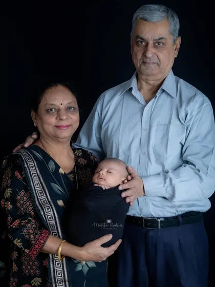 The joy of being grandparents. Including the extended family makes these newborn photos even more special.