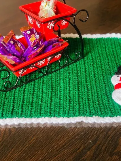 Another look at the green snowman placemat, a festive and functional piece for your table.