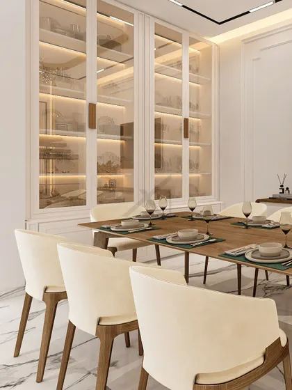 A closer look at the custom display cabinets, where integrated lighting highlights the curated dinnerware and decor.