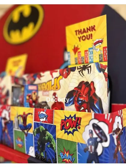 A closer look at the return gift bags, designed with vibrant Spider-Man and Avengers graphics.