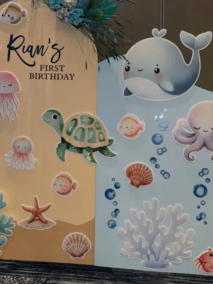 A close-up of the right side of the underwater backdrop, featuring a cute whale, octopus, and crab.