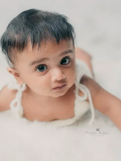 This little one is looking right at the camera, showing off his beautiful eyes and curious expression.