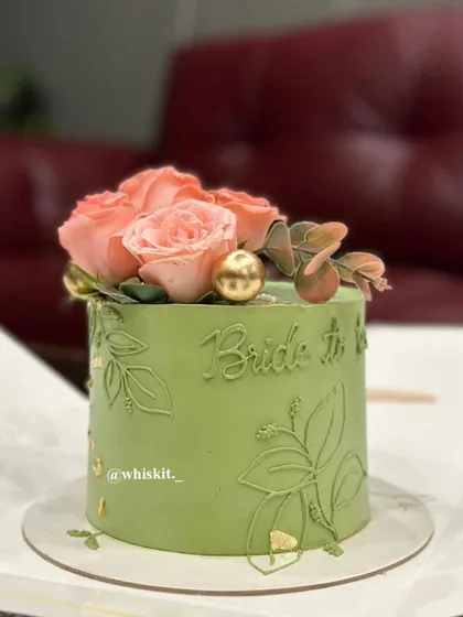 A final look at the elegant sage green and pink rose cake, a perfect choice for a sophisticated bridal celebration.