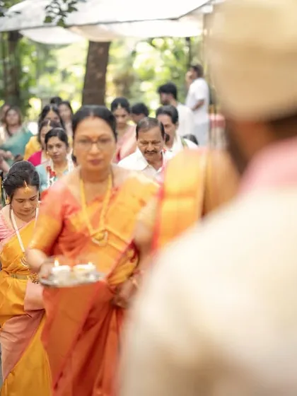 The bride's processional, or Kashi Yatra entry. I captured this from the groom's perspective, showing his bride walking towards him, surrounded by her family.
