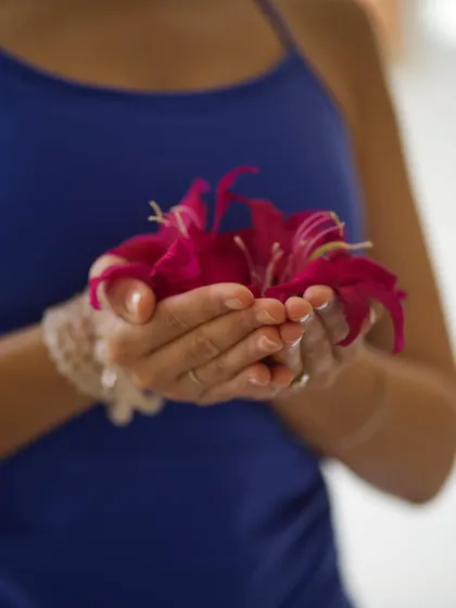 Holding bougainvillea flowers as an offering. The festival of Basant Panchami welcomes spring and reminds us to embrace renewal, wisdom, and new beginnings.