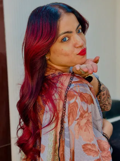 A playful shot of our client loving her new red hair.