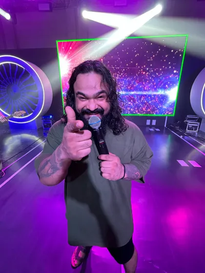Our frontman pointing at the camera, inviting you to join the party. We're all about making a connection.